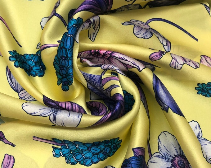 100% silk satin charmeuse digital print 54" wide    Beautiful soft yellow base purplish floral print silky soft fabric 54” wide