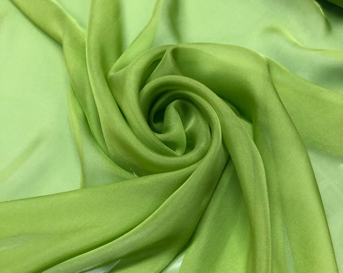 Beautiful aqua green peacock color 100% silk chiffon. 54” wide.  Best used for apparel. Sold by the yard