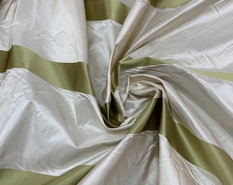 Beautiful 100% silk taffeta satin stripe. Beautiful beige with green satin stripe.  Best used for home Decore & apparel.  Sold by the yard