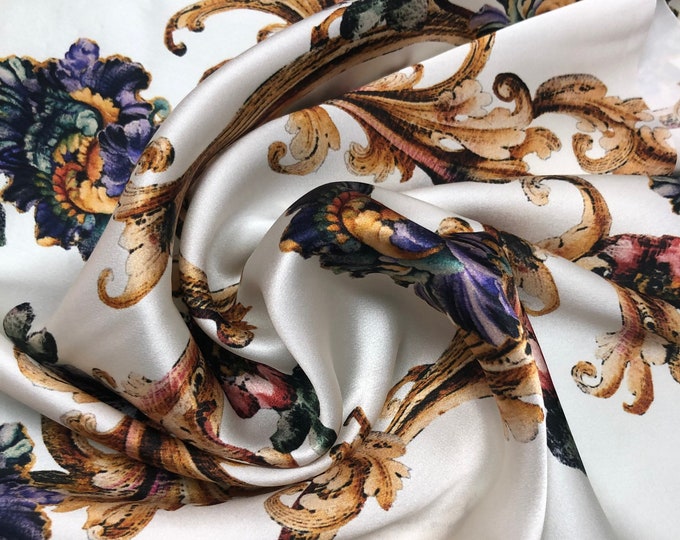 100% silk satin charmeuse digital print 54" wide    Beautiful ivory with gold blue purple floral print silky soft fabric 54” wide