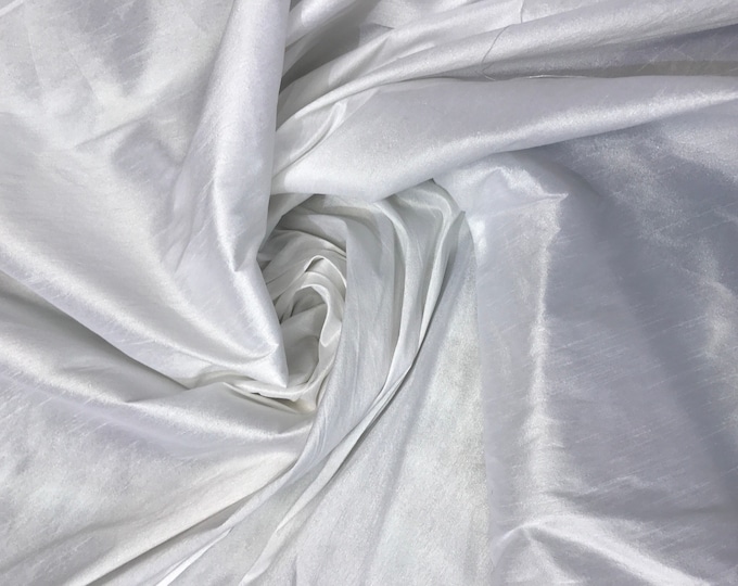 White Shantung/Dupioni fabric. 54" wide. Shantung fabric is unique blend makes this fabric soft and gives structure to dress.