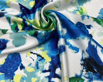 Soft Satin charmeuse digital print 54" wide   Beautiful white ivory base with royal blue green yellow color branded abstract design Fabric