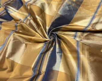 100% silk beautiful gold mustard & blue with gold mustard satin stripe plaids .  silk taffeta 54" wide            Sold by the yard