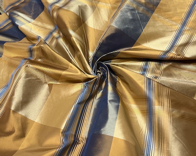 100% silk beautiful gold mustard & blue with gold mustard satin stripe plaids .  silk taffeta 54" wide            Sold by the yard