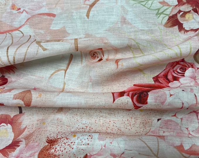 100% Linen designer print, beautiful peach base with coral pinkish wine floral border style designer linen. 58” wide Sold by the yard