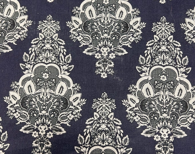 100% Linen designer print, beautiful navy base with white black Jaquard style designer printed linen. 58” wide Sold by the yard