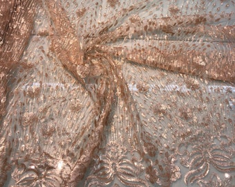 Floral abstract design sequins embroidered on mesh fabric sold by the yard