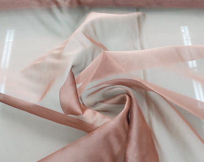 Beautiful taupe rose pink color silk Irredescent organza 54” wide.  Best used for apparel and home Decore.  Sold by the yard