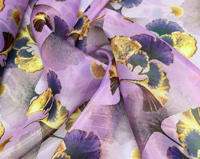 Satin face organza, also called Gazzar 54” wide. Beautiful lilac base with yellow purple color Ginko floral digital design