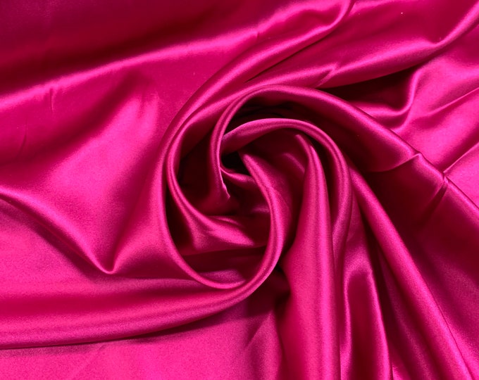 Beautiful fusia color stretch silk satin Charmouse 54” wide.  Best used for apparel.  Sold by the yard