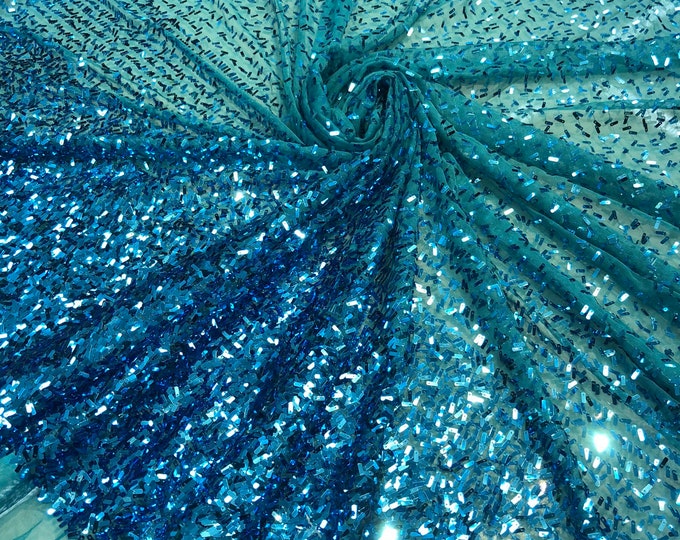 Sequin on tule 58" wide   Beautiful turquise color border style sequin fabric sold by the yard