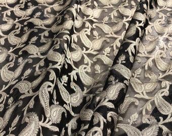 100% silk organza jaquard 45" wide   Beautiful black gold floral design     Sold by the yard