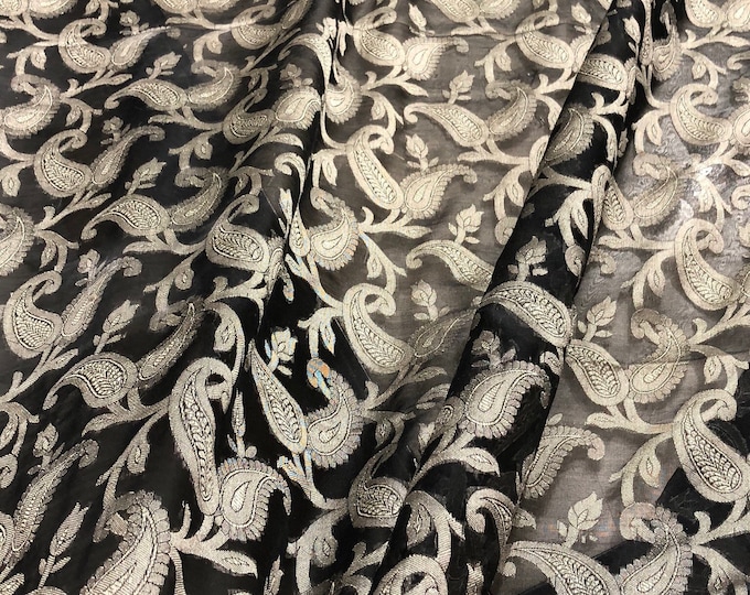 100% silk organza jaquard 45" wide   Beautiful black gold floral design     Sold by the yard