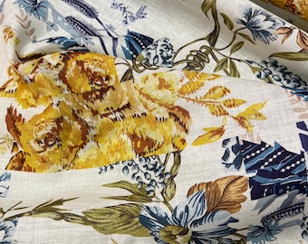 100% Linen designer print, Ivory base with navy blue yellow floral designer printed linen. 58” wide Sold by the yard