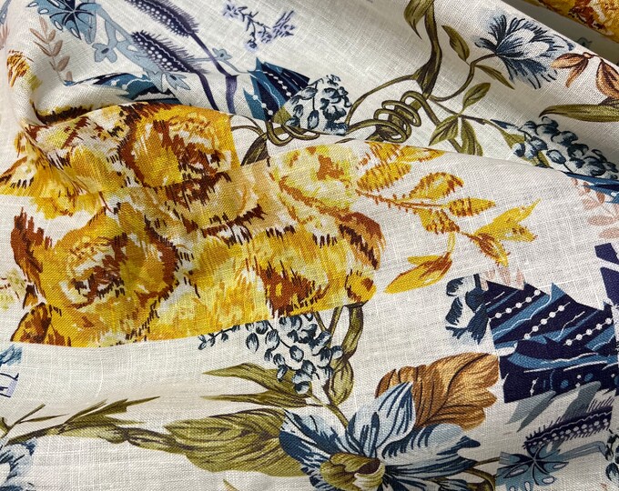 100% Linen designer print, Ivory base with navy blue yellow floral designer printed linen. 58” wide Sold by the yard