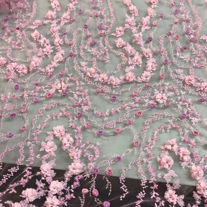 Hand beaded floral design with 3D flowers dusty rose pink color lace on mesh fabric sold by the yard