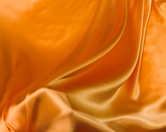 Silk charmouse 54" wide    Beautiful soft  orange color silk satin charmeuse fabric sold by the yard