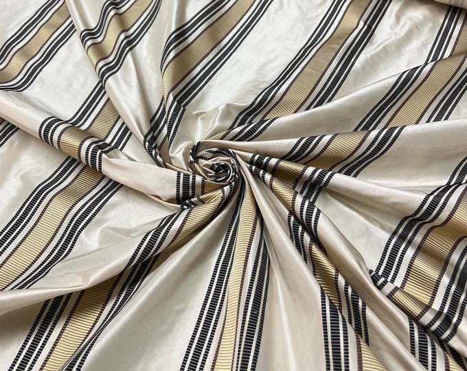 Silk taffeta 54" wide   Beautiful Ivory base, gold with black and gold ribbing stripe silk taffeta fabric sold by the yard
