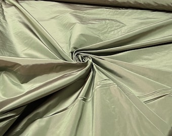 Beautiful olive green Irredescent 100% silk taffeta 54” wide.  Best used for apparel and home Decore.  Sold by the yard