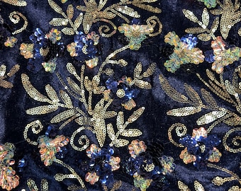 Velvet with sequence embroidered 45" wide   Beautiful Navy velvet with floral leaves sequence blue and gold . sold by the yard