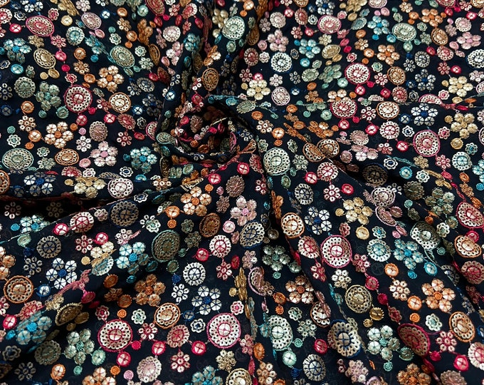 Beautiful black base with red gold green blue embroidered sequin chiffon 46”wide    Beautiful floral embroidered viscose soft chiffon.