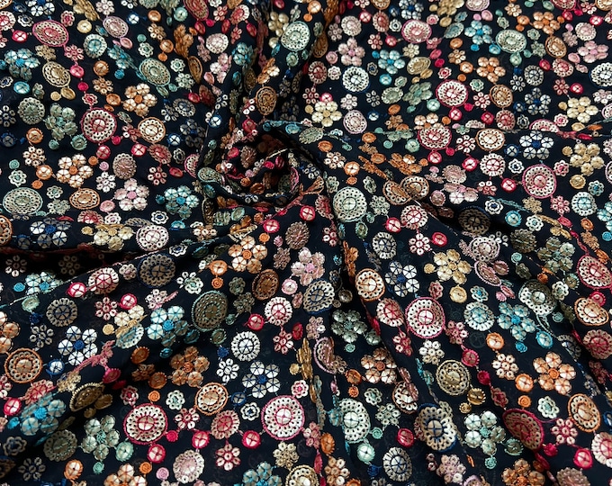 Beautiful black base with red gold green blue embroidered sequin chiffon 46”wide    Beautiful floral embroidered viscose soft chiffon.