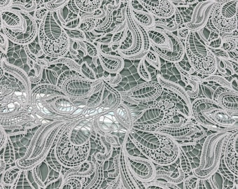 Guipure lace fabric 50” wide. Beautiful paisley style all over design, natural white color.