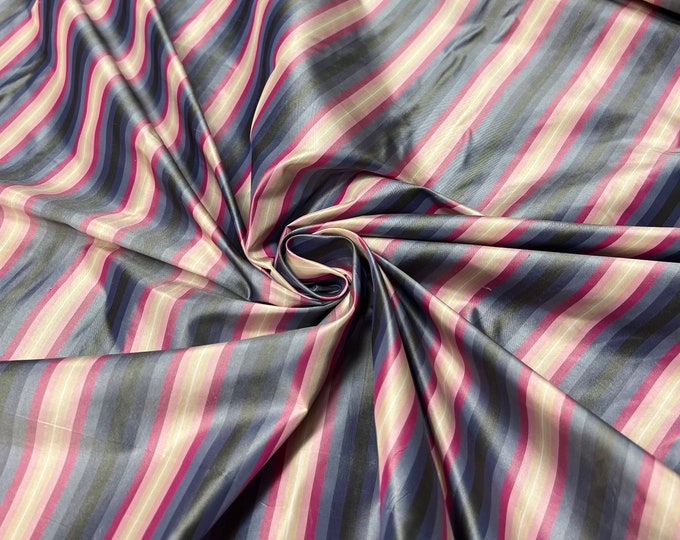 100% silk taffeta stripe 54" wide                      Sold by the yard          Beautiful blue black Fusia with peach pink shades stripes