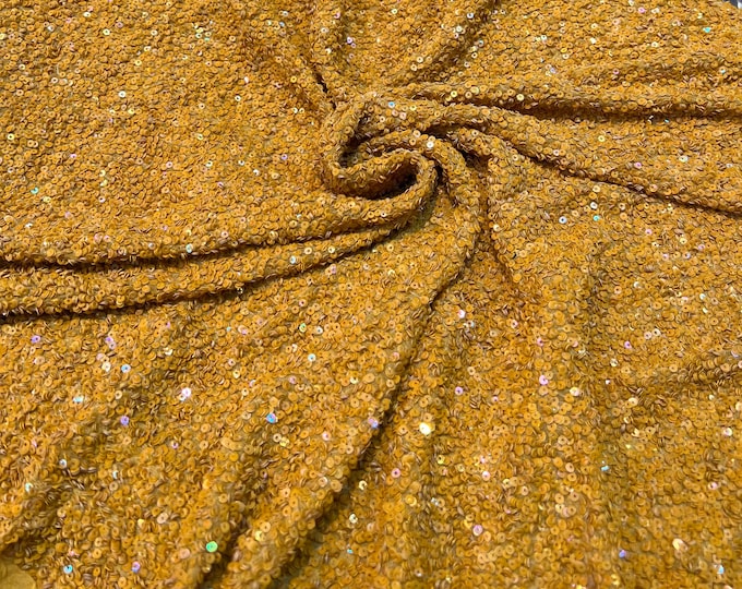 Beautiful yellow mustard color tiny florescent sequin hand embroidered on silk chiffon 45” wide. Best use for apparel