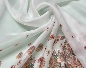 Satin face organza, also called Gazzar 54” wide. Beautiful ivory base with border style peach pinkish floral digital design