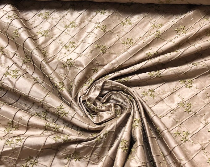 Beautiful 100% silk shantung pintuck embroidery.  Beautiful champagne color with gold color embroidery 52” wide.  Best used for home decor
