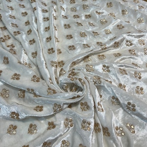 Velvet with sequence embroidered 45&quot; wide   Beautiful Ivory with gold sequenced floral motives. sold by the yard