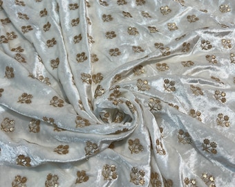 Velvet with sequence embroidered 45" wide   Beautiful Ivory with gold sequenced floral motives. sold by the yard