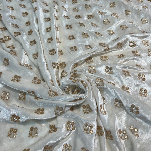 Velvet with sequence embroidered 45" wide   Beautiful Ivory with gold sequenced floral motives. sold by the yard