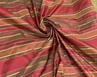 Beautiful burgundy wine with gold satin stripes silk taffeta satin stripes 54” wide. Best used for home decor. Sold by the yard