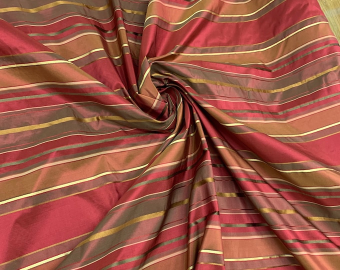 Beautiful burgundy wine with gold satin stripes silk taffeta satin stripes 54” wide. Best used for home decor. Sold by the yard