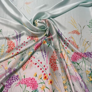 100% silk satin charmeuse digital print 54" wide    Beautiful mint base with pastel colors border style  floral design silk fabric 54” wide