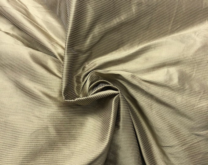 Beautiful silk tan gold color silk taffeta pinstripe 54” wide. Best used for home decor sold by the yard