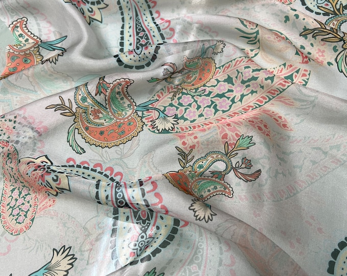 100% silk satin face chiffon digital print 54" wide    Beautiful champagne base with peach orange green tan paisley design