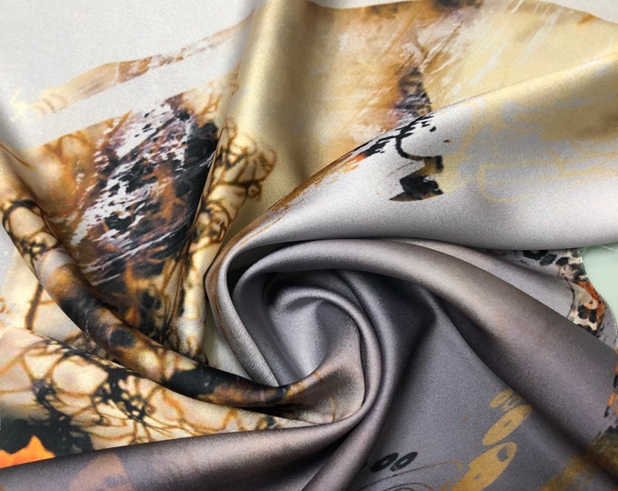 Beautiful copper brown black with orange floral designer digital print on silky satin 54” wide. Sold by the yard. Best used for apparel