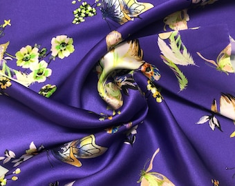 100% silk satin charmeuse digital print 54" wide    Beautiful bright purple woth floral and butterfly print silky soft fabric 54” wide