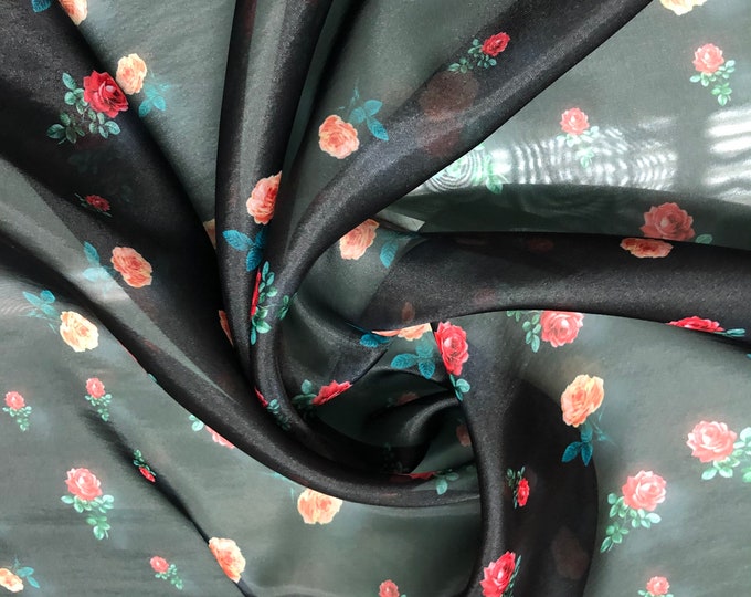 Satin face organza, also called Gazzar 54” wide. Beautiful black base with Fusia red green yellow mix flowers summer design.