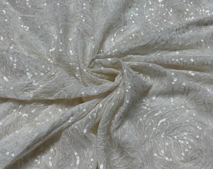 Beautiful white on white embroidered chiffon 46”wide    Beautiful artistic floral sequenced & embroidered viscose soft chiffon.