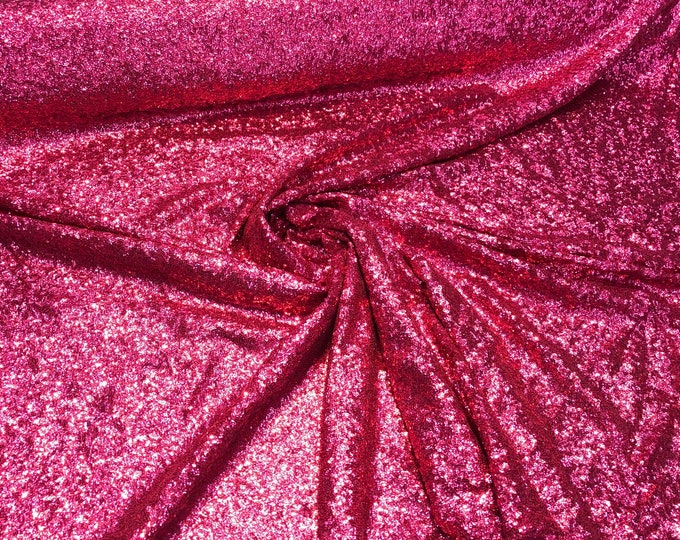 Solid sequins on mesh 52" wide    Top of the line sequins beautiful fusia color sequin fabric sold by the yard