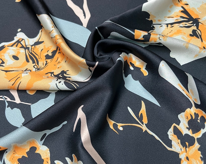 Soft Satin charmeuse digital print 54" wide   Beautiful black base with gold and silver floral style branded design   Fabric sold by yard