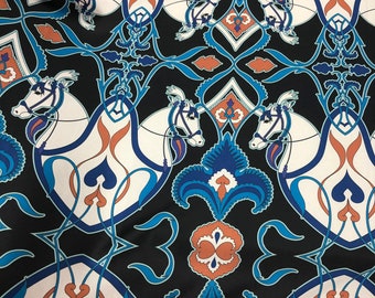 Beautiful belts & horse style teal blue white black color designer print on silky satin 54” wide. Sold by the yard. Best used for apparel