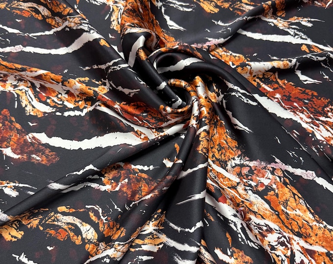 100% silk satin charmeuse digital print 54" wide    Beautiful black base with copper gold abstract design silk fabric 54” wide