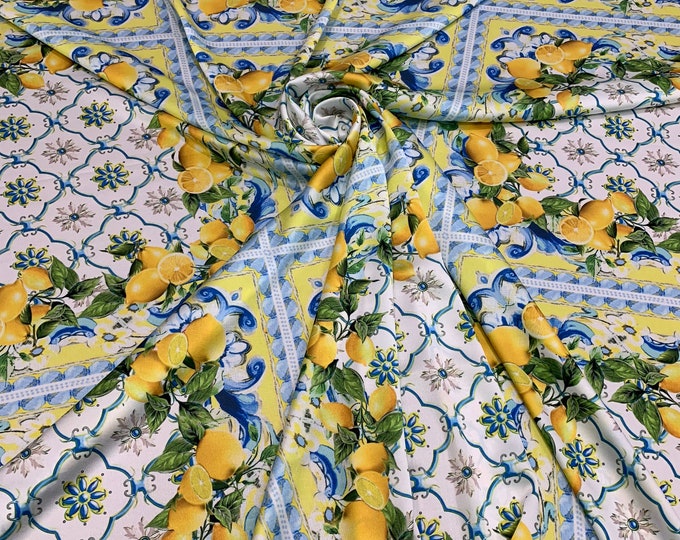 Digital satin Charmouse print 54” wide.  Beautiful whote base with yellow green panel print beat used for apparel.  Sold by the yard