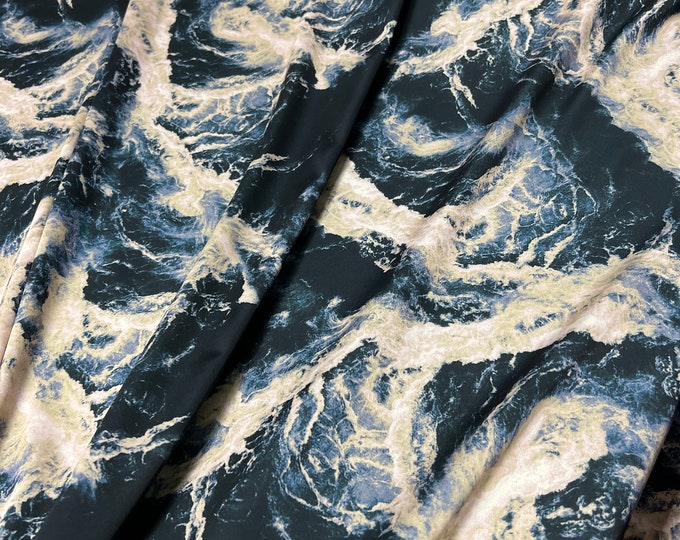 Beautiful black base with gold gray water style abstract design silky satin 54” wide. Sold by the yard. Best used for apparel