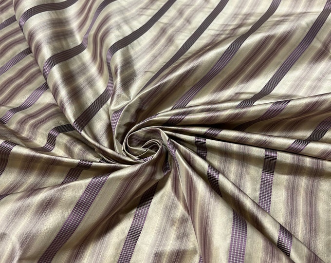 100% silk satin stripe beautiful beige tan gold with purple silk satin stripes.  silk satin taffeta 54" wide            Sold by the yard